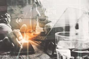 Double exposure of smart medical doctor working with smart phone,digital tablet computer,stethoscope and London city,eyeglass,on wood desk photo