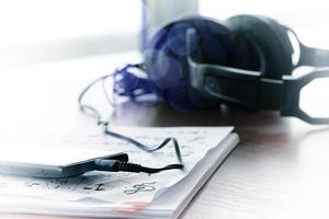 composing music concept with shallow DOF evenly matched jack of headphone and copy space photo