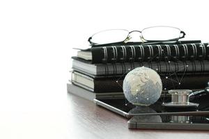 Studio macro of a stethoscope and texture globe with digital tablet with shallow DOF evenly matched abstract as medical network concept Elements of this image furnished by NASA photo