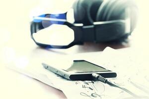 composing music concept with shallow DOF evenly matched jack of headphone and copy space photo