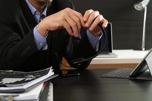 Man using VOIP headset with digital tablet computer as concept communication or it support or call center and customer service in modern office photo