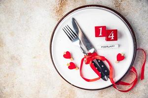 table setting valentines day cutlery fork, knife, plate valentine holiday food background photo