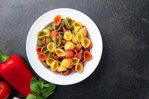 pasta conchiglie colorful mix green, yellow, red broccoli, carrot, beet color healthy meal food snack photo