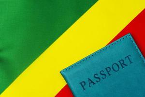 On the background of the flag of the Republic of Congo is a passport. photo