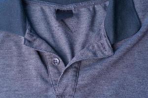 A Dark gray Polo shirt with a cotton collar and gray buttons. photo