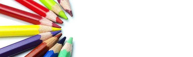 Colorful pencils and place for text on white background. Education concept and back to school concept.Top view. photo