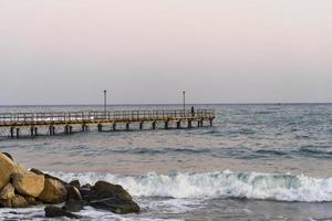 Wooden pier in Limassol overlooking the sea. photo