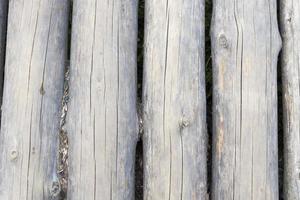 Modern Hand Hewn Natural Log Cabin Wall Facade Fragment Texture. Rustic Log Wall Horizontal Timber Background.