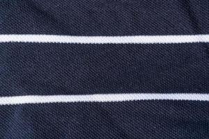 Black fabric with two white stripes of their cotton. photo