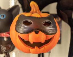 traditional Halloween carved pumpkin in the shape of a cat head. photo