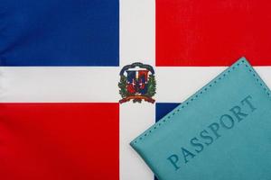 Against the background of the flag of the Dominican Republic is a passport. photo
