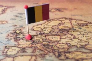 Belgium marked with a flag on the map. Flag of Belgium on the world map. photo