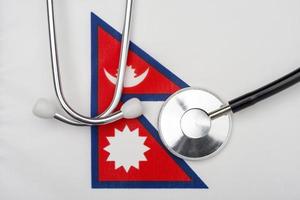 Nepal flag and stethoscope. The concept of medicine.