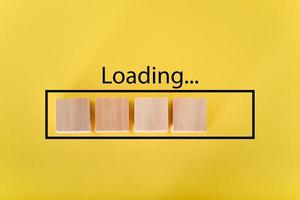 Loading the progress bar with wooden cubes. Download progress. Loading status photo