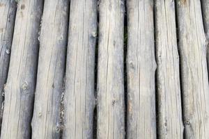 Modern Hand Hewn Natural Log Cabin Wall Facade Fragment Texture. Rustic Log Wall Horizontal Timber Background.