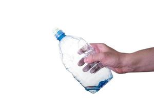 A man holding an empty, plastic bottle, isolated on a white background. photo