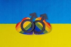 The flag of Ukraine and the heart in the form of the LGBT flag. photo