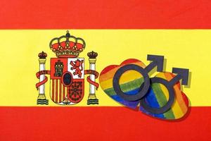 The flag of Spain and the heart in the form of the LGBT flag. photo