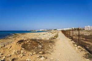 Cyprus coast on the horizon hotels. Sea and mountain views. photo