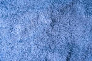 large towel cloth of soft blue terry texture rotates photo