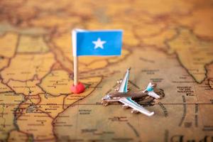 Flag Airplane and airplane on the world map and airplane. photo