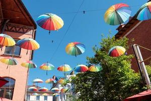 There are many colorful umbrellas in the sky. photo