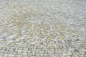 textura de círculo de pavimentación de piedra. fondo estructurado abstracto del patrón de losas de pavimento de la calle moderna foto