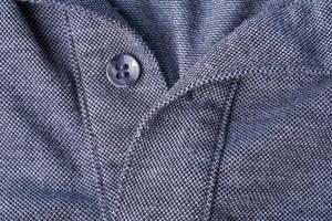 A Dark gray Polo shirt with a cotton collar and gray buttons. photo