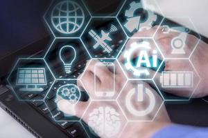 Double exposure of creative artificial Intelligence icon with hands typing on laptop on background. photo