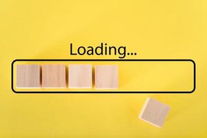 Loading the progress bar with wooden cubes. Download progress. Loading status photo