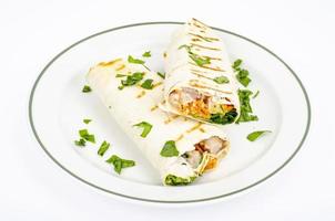 Two shawarmas on plate isolated on white background. Studio Photo