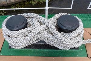 Sea knot on a ship deck Mooring rope. photo