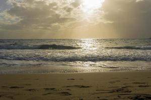 The sea and clouds covered the sun. photo