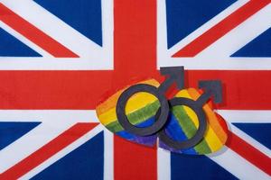 The flag of Great Britain and the heart in the form of the LGBT flag. photo