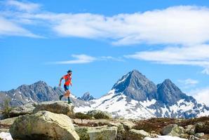 Ultra mountain trail athlete in action during training photo