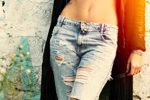 Ripped jeans girl photo