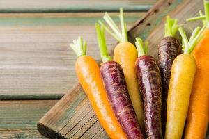 Fresh raw colorful carrots roots photo