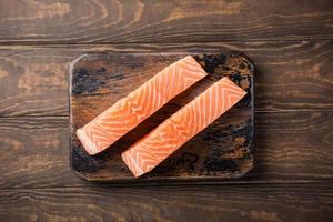 Fresh raw salmon fillet, flat lay photo
