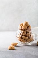 Amaretti cookies with white cup of coffee photo