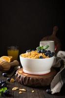 Healthy breakfast with corn flakes and berries photo