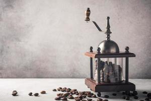 Retro coffee mill with beans photo