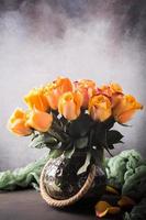 Beautiful bouquet of yellow roses in vintage vase photo