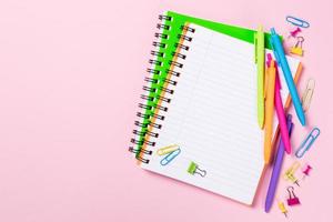 School background with notebooks and colorful supplies photo