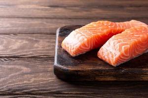 Fresh raw salmon fillet, flat lay photo