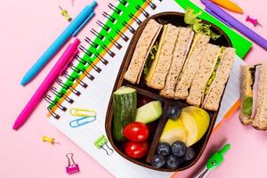 School wooden lunch box with sandwiches photo