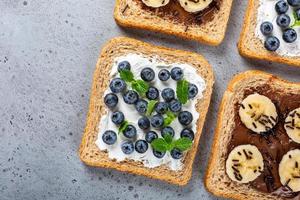 Delicious open sandwich with chocolate and banana photo