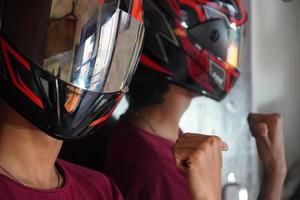 man with bike helmet and happy in mirror image photo