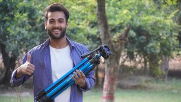 Young blogger with tripod -Indian Blogger images photo