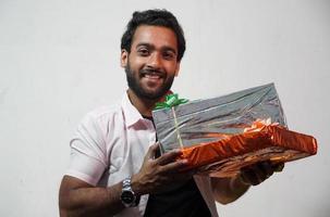 Man holding festival gifts photo