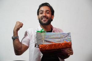 Man holding and exited festival presents and happy photo